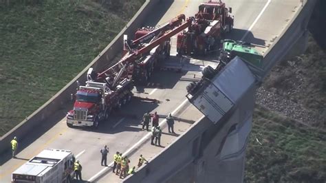 Truck dangles on overpass in Pennsylvania after tipping over